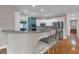 Kitchen with breakfast bar featuring granite countertops, stainless appliances, and seating for three at 931 Cornwall Sw Ct, Marietta, GA 30064