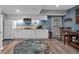 Cozy kitchenette features white cabinets, granite counters, a microwave, and a trendy circular area rug at 931 Cornwall Sw Ct, Marietta, GA 30064