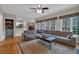 Inviting living room features a large sectional sofa, area rug, and a ceiling fan at 931 Cornwall Sw Ct, Marietta, GA 30064