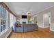 Open living room with hardwood floors, fireplace, and large windows providing natural light at 931 Cornwall Sw Ct, Marietta, GA 30064