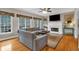 Cozy living room with hardwood floors, fireplace, and large windows providing natural light at 931 Cornwall Sw Ct, Marietta, GA 30064