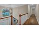 This staircase has a modern chandelier and large window letting in lots of light at 931 Cornwall Sw Ct, Marietta, GA 30064