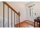 Inviting foyer with hardwood floors, staircase, and white door with glass accents at 2105 Caswell Cir, Marietta, GA 30060