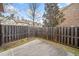 A view of the fenced backyard with a concrete pad at 2105 Caswell Cir, Marietta, GA 30060