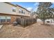 Fenced backyard with view of exterior featuring brick and vinyl facade at 2105 Caswell Cir, Marietta, GA 30060