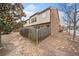 View of the side and rear of the property featuring a fenced yard and a brick facade at 2105 Caswell Cir, Marietta, GA 30060