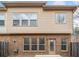 Back of townhome featuring brick and vinyl siding with a door to the backyard at 2105 Caswell Cir, Marietta, GA 30060
