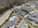 Overhead shot showcasing the community's layout, including townhomes and the pool area, with surrounding roads at 6682 Sterling Dr, Atlanta, GA 30328