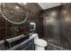 Sleek bathroom with black marble tile, modern vanity, and walk-in shower at 6682 Sterling Dr, Atlanta, GA 30328