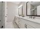 Large primary bathroom features a double vanity and walk-in shower with shower head at 6682 Sterling Dr, Atlanta, GA 30328