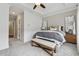 Neutral bedroom with tray ceiling, ceiling fan, and luxury carpeting at 6682 Sterling Dr, Atlanta, GA 30328