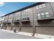 Contemporary townhome complex with gray siding, balconies and garage parking at 6682 Sterling Dr, Atlanta, GA 30328
