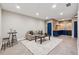 Cozy living room adjacent to kitchen featuring plush seating and stylish decor at 6682 Sterling Dr, Atlanta, GA 30328
