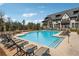 Relaxing community pool with lounge chairs and ample space for recreation, set against a scenic backdrop at 6682 Sterling Dr, Atlanta, GA 30328