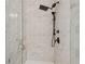 Elegant walk-in shower with a rainfall showerhead and a handheld shower fixture at 6682 Sterling Dr, Atlanta, GA 30328
