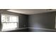 Bedroom with a ceiling fan and a window at 6831 Lismore Dr, Norcross, GA 30093