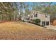 View of a charming tan home, featuring an attached garage and sprawling lawn at 12 Remington Ct, Euharlee, GA 30145
