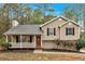 Charming home with a inviting front porch, complemented by a lush, landscaped yard at 12 Remington Ct, Euharlee, GA 30145