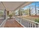 Inviting front porch featuring a warm wood deck and views of the neighborhood at 12 Remington Ct, Euharlee, GA 30145