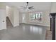 Spacious living room with stairs, large window, front door, and view to fireplace at 12 Remington Ct, Euharlee, GA 30145
