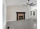 Bright living room featuring a fireplace, large windows, and neutral paint colors at 12 Remington Ct, Euharlee, GA 30145