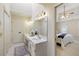 Bright bathroom with double vanity, white cabinets, and neutral finishes at 210 Chiswick Close, Johns Creek, GA 30022