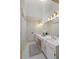 Bright bathroom with double vanity, white cabinets, and neutral finishes at 210 Chiswick Close, Johns Creek, GA 30022