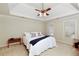 Bright bedroom featuring a bed with white linens and neutral walls at 210 Chiswick Close, Johns Creek, GA 30022