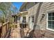 Inviting outdoor deck with grill, seating, and access to the home's interior at 210 Chiswick Close, Johns Creek, GA 30022