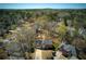 Charming two-story home with a well-manicured lawn and mature trees in a peaceful neighborhood at 210 Chiswick Close, Johns Creek, GA 30022