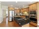 Updated kitchen featuring granite countertops, stainless steel appliances and wood floors at 210 Chiswick Close, Johns Creek, GA 30022