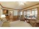 Comfortable living room with access to a screened-in porch and a built-in wet bar at 210 Chiswick Close, Johns Creek, GA 30022