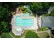 Aerial view of a community pool with a slide, splash pad, and a sunbathing area at 210 Chiswick Close, Johns Creek, GA 30022
