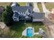 Expansive backyard with a sparkling pool, gazebo, and lush greenery at 2329 Walker Dr, Lawrenceville, GA 30043