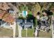 Aerial view of the home showcasing the pool, manicured lawn, landscaping, and surrounding neighborhood at 2329 Walker Dr, Lawrenceville, GA 30043