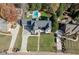 An aerial view of the residence showcasing a well-manicured lawn, modern architecture, and a spacious driveway at 2329 Walker Dr, Lawrenceville, GA 30043