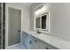 Modern bathroom featuring a sleek vanity, illuminated mirror, and elegant marble countertops at 2329 Walker Dr, Lawrenceville, GA 30043