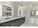 Elegant bathroom boasting double sinks, marble countertops, LED mirrors, and access to the bedroom space at 2329 Walker Dr, Lawrenceville, GA 30043