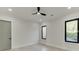 Bright bedroom featuring hardwood floors and neutral walls at 2329 Walker Dr, Lawrenceville, GA 30043