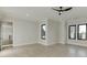 Bright, open bedroom with hardwood floors, a modern ceiling fan, and lots of natural light at 2329 Walker Dr, Lawrenceville, GA 30043