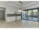 Bright dining area with a view of the outdoor deck and landscaped backyard at 2329 Walker Dr, Lawrenceville, GA 30043
