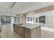 Open-concept kitchen with a large island, sleek countertops, and modern lighting fixtures at 2329 Walker Dr, Lawrenceville, GA 30043