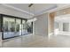 Bright living area with sliding glass doors leading to an outdoor deck and landscaped yard at 2329 Walker Dr, Lawrenceville, GA 30043