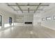 Bright living room with fireplace, custom shelving, and hardwood floors at 2329 Walker Dr, Lawrenceville, GA 30043