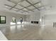 Open-concept living room featuring modern fireplace, hardwood floors, and abundant natural light at 2329 Walker Dr, Lawrenceville, GA 30043