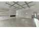 Spacious living room with built-in storage, hardwood floors and coffered ceilings at 2329 Walker Dr, Lawrenceville, GA 30043