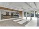 Open concept living and kitchen area with light wood floors and recessed lighting at 2329 Walker Dr, Lawrenceville, GA 30043