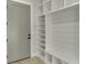 Mudroom features custom shelving, storage space, and a convenient entry door at 2329 Walker Dr, Lawrenceville, GA 30043