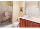 Cozy bathroom features a shower, toilet, and vanity sink with a framed mirror at 1527 Sage Ridge Dr, Marietta, GA 30064