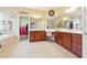 Bright bathroom with a double vanity, tile flooring, and a decorative floral accent at 1527 Sage Ridge Dr, Marietta, GA 30064